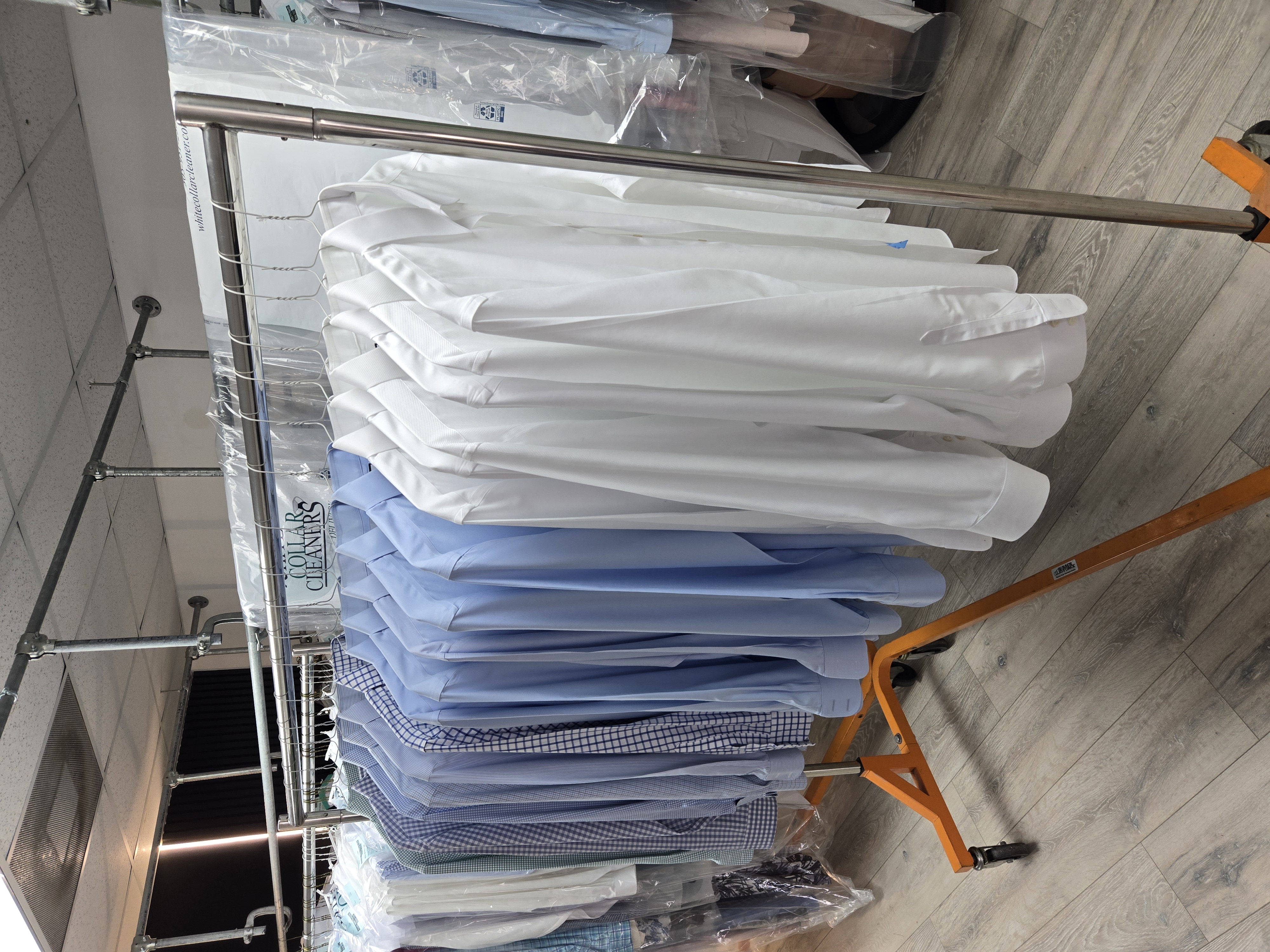 Freshly laundered and pressed shirts on hangers