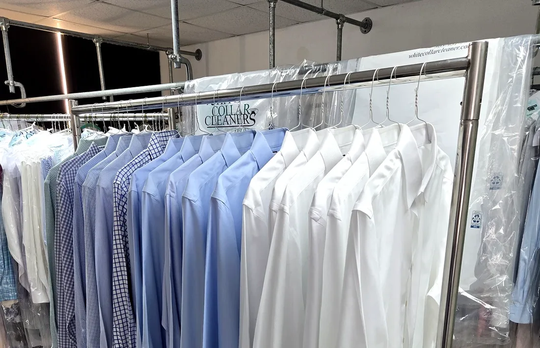 Freshly laundered and pressed shirts on hangers
